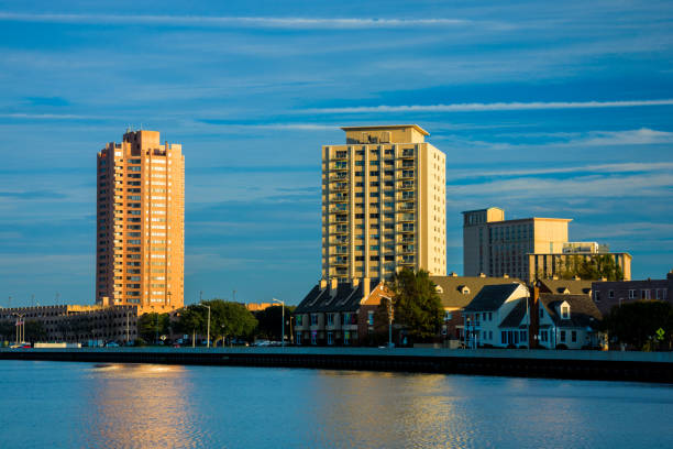 Portsmouth skyline with Elizabeth River and houses in the foreground, taken in the late afternoon.   Portsmouth is part of the Virginia Beach / Hampton Roads area.