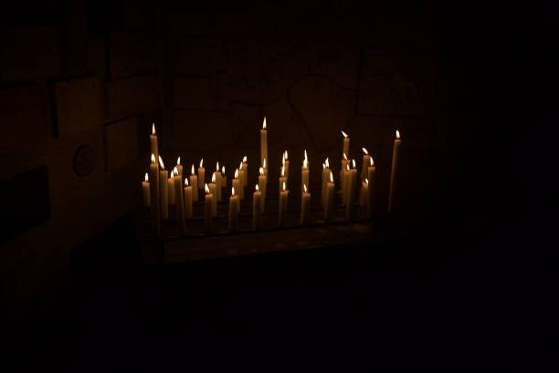 istock Burning candles in the dark 2159040110