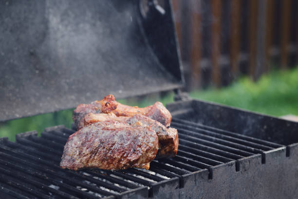 istock Closeup view of strip steak on grill 2159043601