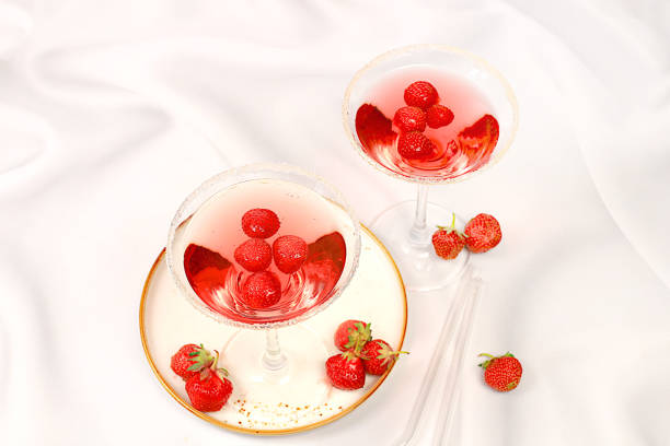 istock Festive alcoholic cocktail, red martini in glasses on a bright background with strawberries, summer bar concept, alcoholic drinks at a party, restaurant and cafe advertising, selective focus. 2159046452