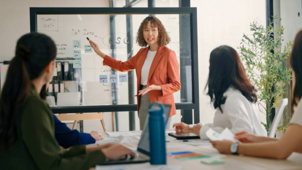 istock Team Discussing ESG Strategies in a Modern Office 2159048996