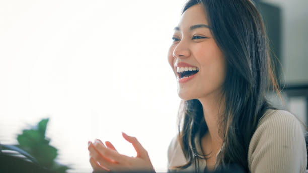 Cheerful Businesswoman Applauding in a Modern Office