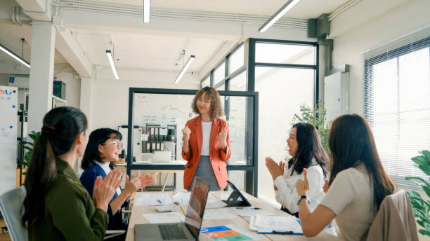 istock Business Team Applauding Female Leader During ESG Presentation 2159049056