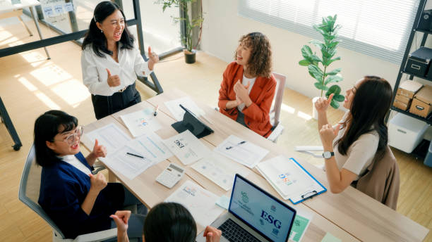 istock Business Team Applauding Female Leader During ESG Presentation 2159049074