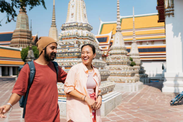 istock Smiling couple on vacation visiting famous architecture in Thailand 2159050283