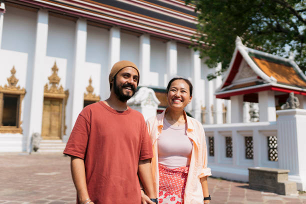 istock Cheerful diverse couple enjoying a walk together in ancient place 2159050399