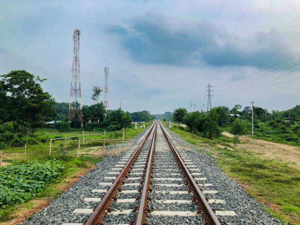 istock Railway tracks in the countryside in a rainy day 2159051162