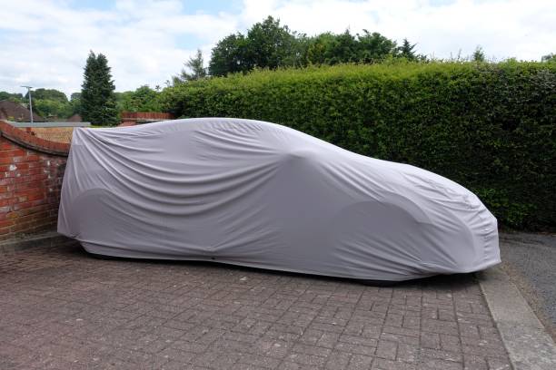 istock Vehicle under protective cover in parking area 2159051857