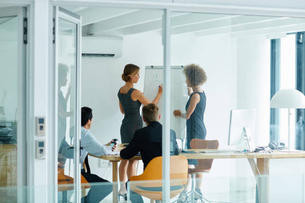 istock Office, discussion and white board for presentation, planning and erp notes with meeting for report. Men, women and team for business, teamwork and collaboration for partnership or b2b project 2159057970