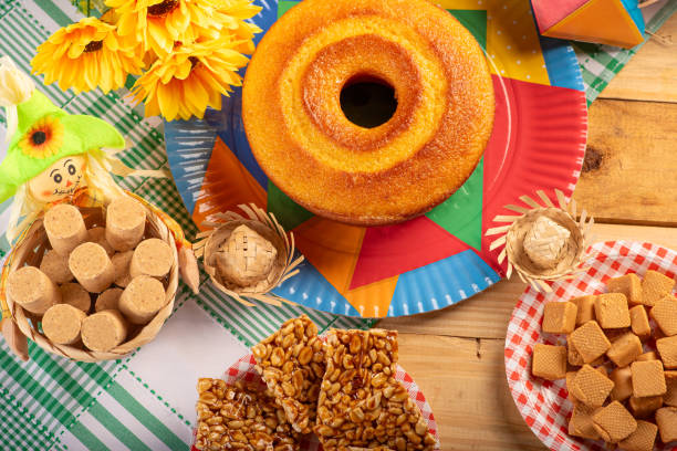 istock Festa Junina, beautiful rustic table with dishes containing various types of sweets for Festa Junina in Brazil, top view. 2159059133