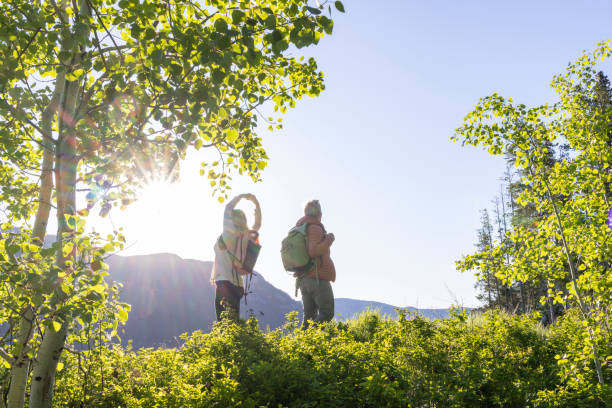 istock Mature couple explore mountain meadow 2159059188