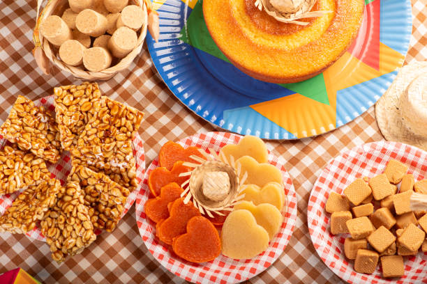 istock Festa Junina, beautiful rustic table with dishes containing various types of sweets for Festa Junina in Brazil, top view. 2159059524
