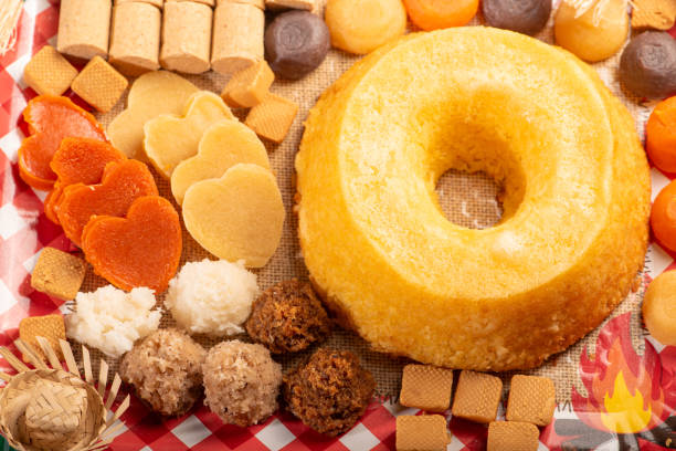 istock Festa Junina, beautiful rustic table with dishes containing various types of sweets for Festa Junina in Brazil, top view. 2159059610