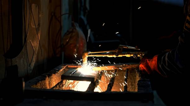 istock Man doing welding work on iron close-up photo 2159061151