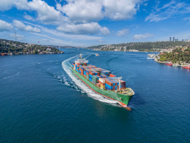 istock Aerial view of cargo container ship with a tugboat in transit. Istanbul Bosphorus. 2159066016