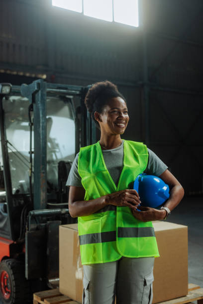 istock Customs warehouse female worker standing and smiling in the warehouse 2159067726