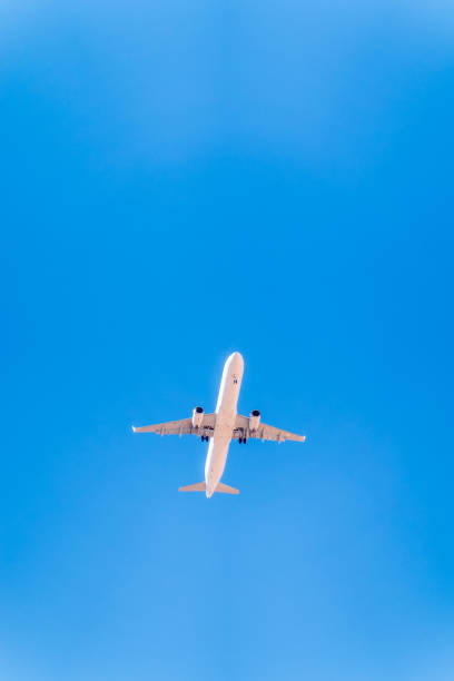 istock Airplane before landing in blue sky, Airbus A321-200 2159067908