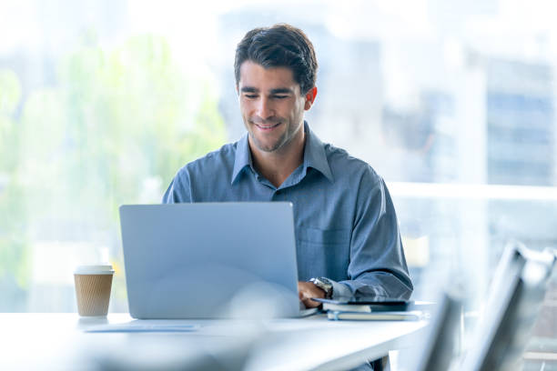 istock Serious Businessman working on a laptop computer in the office. 2159068617