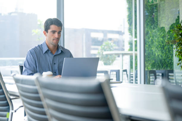 istock Serious Businessman working on a laptop computer in the office. 2159070284