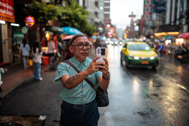 istock Man taking pictures with phone 2159071071
