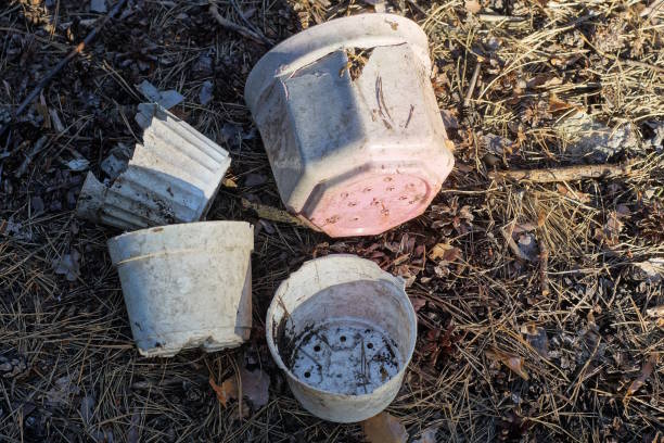 istock four white pink old dirty plastic broken flowerpots 2159073582