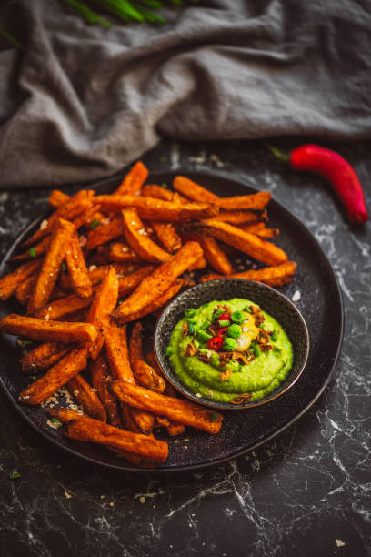 istock Sweet Potato Fries with Pea Guacamole 2159074878