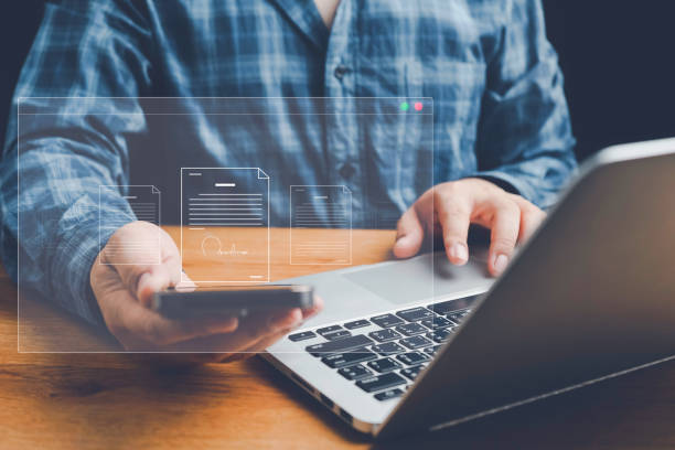 istock Checklist, Digital and smart checklist document concept, Businessman marking on e-checklist on virtual screen and use laptop document management with modern intelligent online systems high security. 2159075781