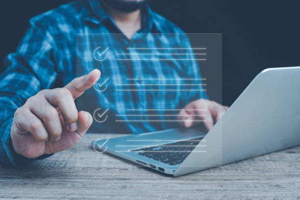 istock Business performance checklist, Business evaluation, project approval and enhancing business performance. Businessman checking mark on check box to approved documents. documentation management. 2159075814