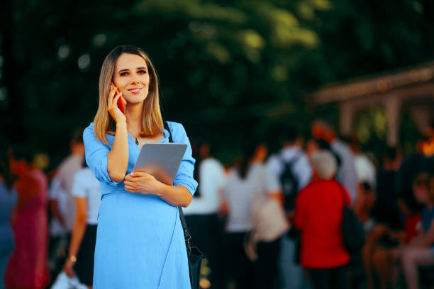 istock Happy Event Coordinator Holding Pc Tablet Talking on the Phone 2159079687