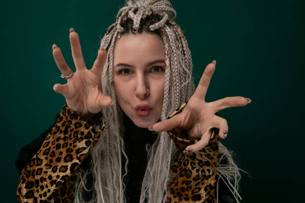 Woman Wearing Leopard Print Jacket Making Peace Sign