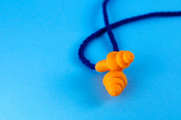 istock Pair of orange earplugs 2159086441