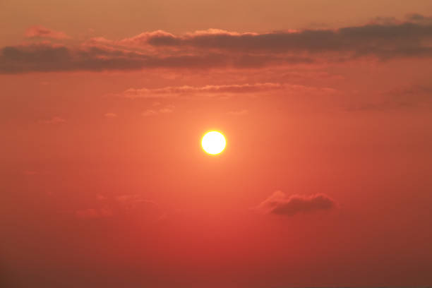 Sunrise on a sunny day with orange sky clouds