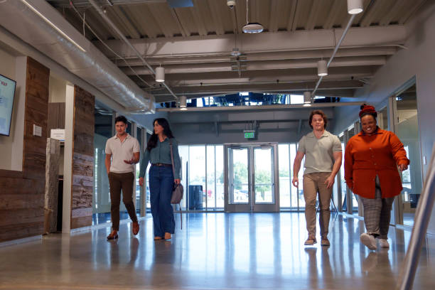 istock Diverse Group of Four Young Business People Entering a Co-Working Space Getting Ready to Go to Work 2159091608