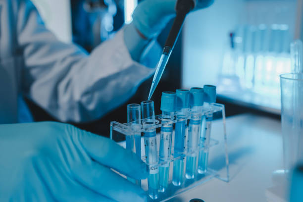 a scientist is working in a laboratory, a chemical researcher is preparing sample for a vaccine against a virus, work in lab concentrate is the most important because chemicals are dangerous