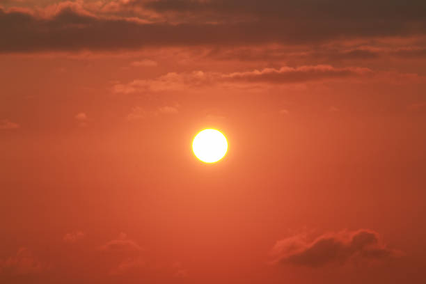 Sunrise on a sunny day with orange sky clouds