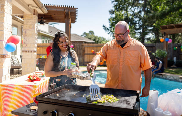 istock Happy family having a barbecue in their back yard 2159102812