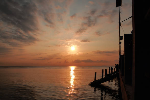 istock sunrise on the beach pier bridge with a clear sky 2159103097