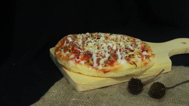 istock photo of pizza on a cutting board 2159112509