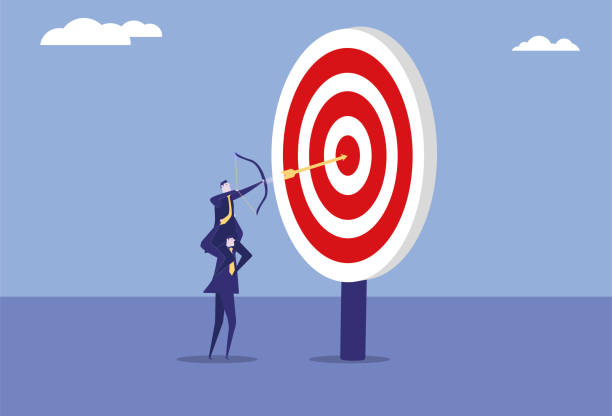 istock Two business men team up to shoot an arrow into the bull's eye 2159113725