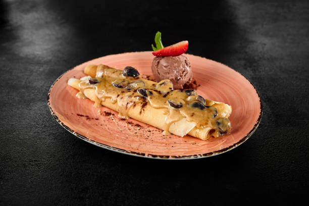 Delicious Pancakes with Caramel Sauce and Chocolate Ice Cream - Indulgent Dessert on Artistic Plate