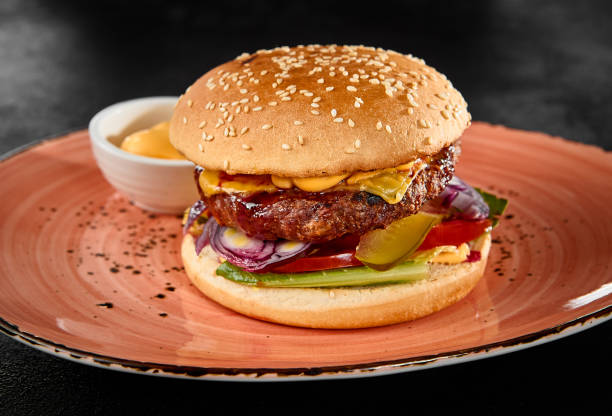 Delicious Beef Patty Burger with Fresh Toppings and Sesame Seed Bun