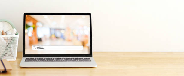 istock Laptop computer with www. on search bar over blur store on screen with copy space, on line shopping ,business, E-commerce, technology and digital marketing concept background 2159119352