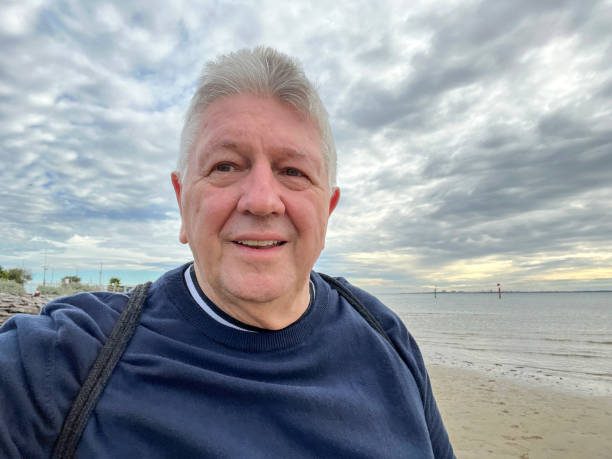 istock Senior Caucasian man selfie outdoors at beach 2159119742