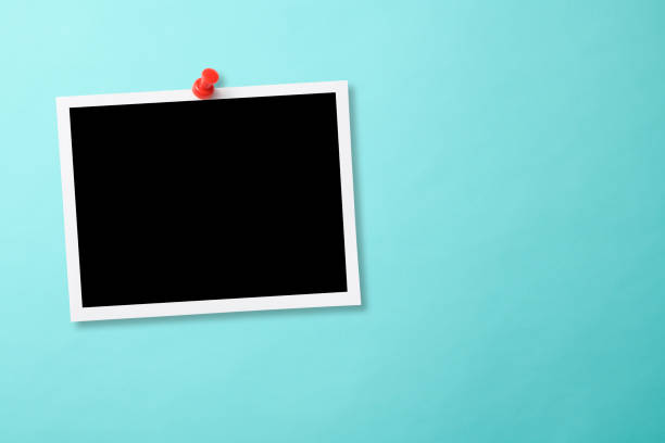 istock Pinned blank photo with thumbtack on light blue background 2159120765
