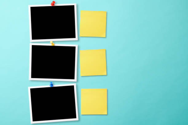 istock Pinned blank three photo with thumbtack on light blue background with yellow sticky note 2159120771