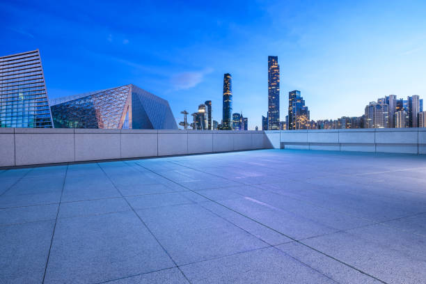 istock Empty square floors with modern city buildings at night 2159123603