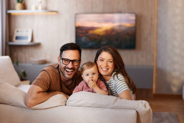 istock Happy family relaxing on sofa at home. 2159123811