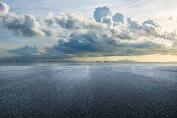 istock Asphalt road square and sea with sky clouds natural background 2159124025