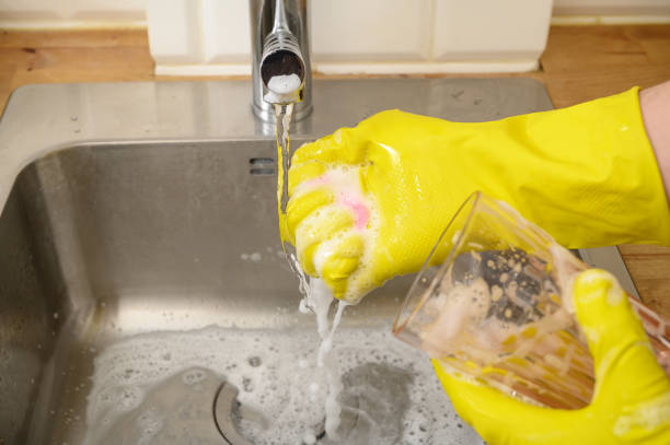istock Hands dry from dishwashing liquid, wash dishes with protective gloves 2159124159