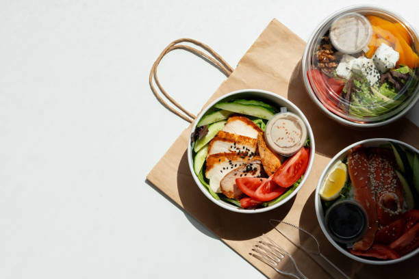 Take out poke bowl with craft bag on white background